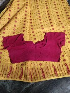 Elegant Yellow Saree with red Blouse.