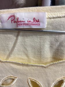 Pale Yellow Top with Cutouts