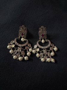 “Traditional Indian earrings with pearls and white