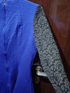 woolen top with net sleeves and back zip i used only once because it has deep neck from front and becoz of size issue