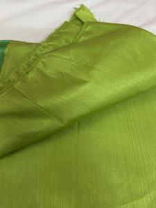 Green banarasi zari suit.
