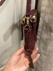 Fossil burgundy sling bag