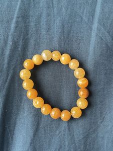 Beaded Bracelets In The Colours Green And Ochre