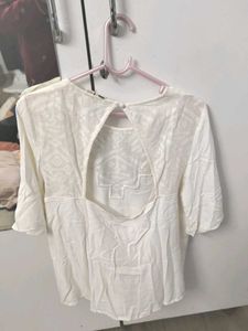 Elegant White Top With Geometric Detailing