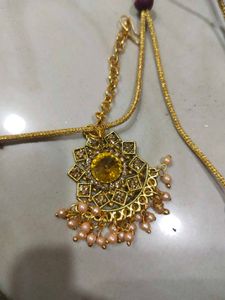 Golden Colour Choker With Earring Pair And Tika