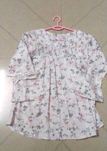 This white dress has beautiful floral designs on