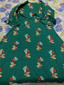 Its a Dark Green Colour Full Length Gown With Print Of Beautiful Flowers Overall In Xxl Size