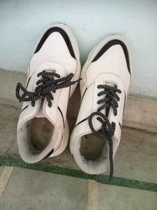 white and black women's sneakers