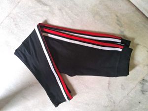 Black active wear with red and white stripe