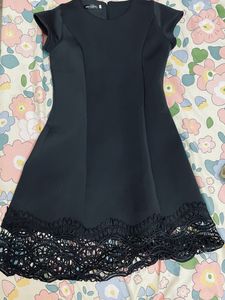 Chic Black Dress with Lace Hem