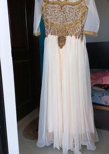 Elegant cream Anarkali set, with beautiful sequence embroidery and border
