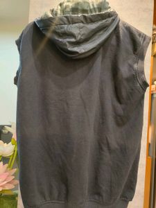 Woolen Sleevless Jacket With Attached Cap