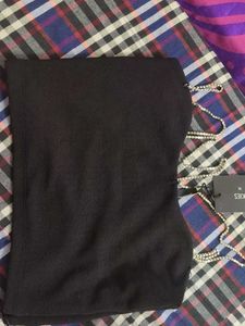 A Black Top With Stones Straps