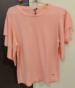 Pink Top With Ruffled Sleeves. Looks Great