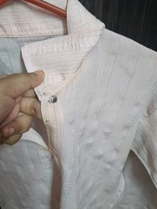 Pink chiffon shirt.