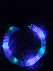 light-up pop tube, a sensory and fidget toy.