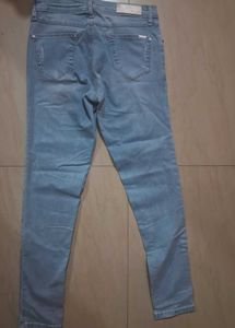 Distressed Light Wash Denim Jeans