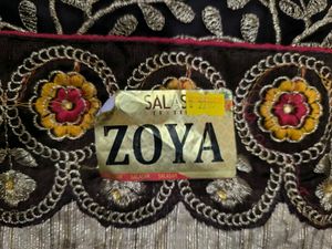 Yellow and brown new saree with intact blouse piec