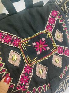 EMBROIDERED BACKPACK