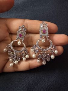 “Traditional Indian earrings with pearls and white