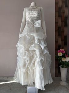 VOLUMINOUS RUFFLED ORGANZA WEDDING GOWN