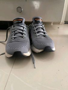 Walk comfortably in grey Skechers