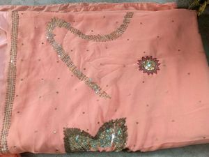 Peach colour saree with blouse and peticoat