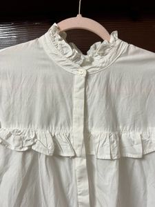 Elegant White Ruffle Blouse with High Neck Detail