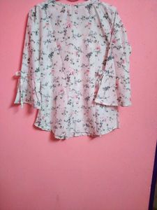 This white dress has beautiful floral designs on