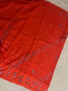 Orange Saree With Blue Shiny Embroidery