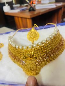 Golden Rajasthani Haar With Long Earrings And Tika