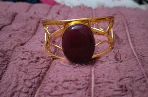 Gold Tone Cuff Bracelet with Maroon Stone