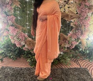 Beautiful Peach Saree with Feather Detail