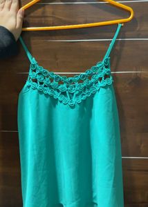 It Is A Teal Green Coloured Top Of Free Size.