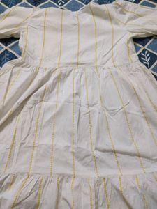 whote gown with yellow stripe