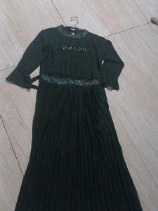 a green color gown having  modern look
