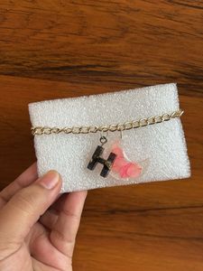 Bracelet with initial letter and real flower
