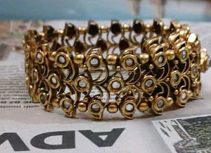 Stunning Gold-Toned Bangle Bracelet with Faux Diam