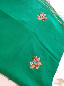 Pure georgette saree in green color  embroidered flower  ?
