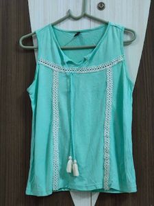 cyan sleeveless top 🩵