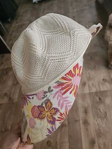 Sun Protection Cap And Black Ceramic Flower Vase