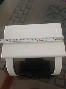 white tissue holder with flat storage on top