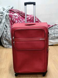 American Tourister Red DC Superlight Trolley Bag