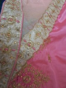 It Is Pink Color Georget With Golden Net Border .