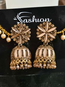 Gold Tone Jhumka Earrings with Pearl Details