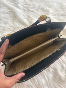 Striped Clutch with Unique Handle