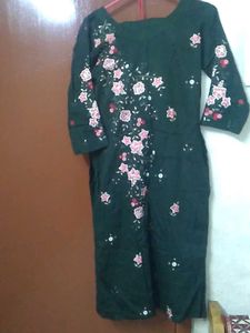 dark green kurti and pant set.