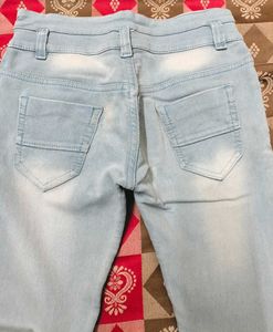 Light Blue Jeans With Criss Cross Design