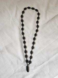 Black Bead Necklace with Lion Nail Pendant