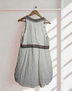 White Boho A Line dress with colourful embroidery.